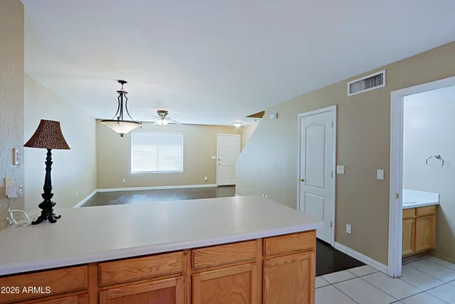 a kitchen with a sink and a mirror