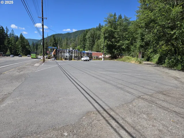a view of a street with a building in the background