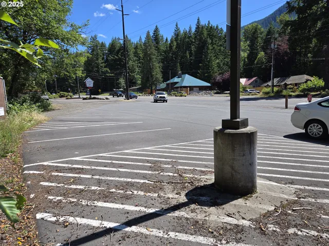 a view of street with parked cars