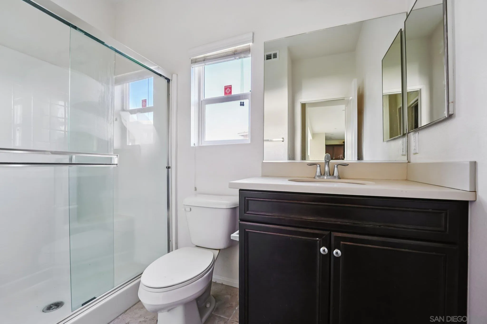31890 Rouge Lane Menifee, CA 92584 - Photo 12 of 40 a bathroom with a sink toilet a mirror and shower