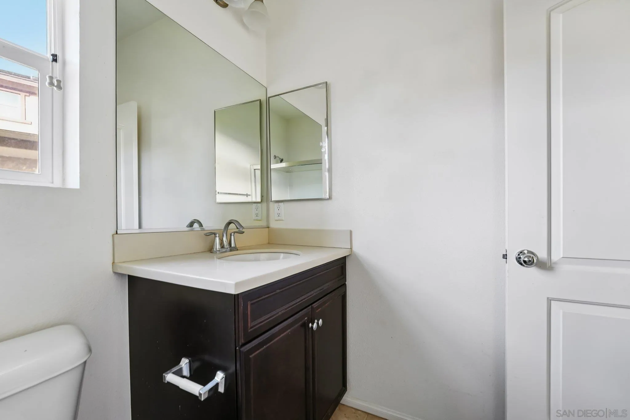 31890 Rouge Lane Menifee, CA 92584 - Photo 13 of 40 a bathroom with a granite countertop sink and a toilet