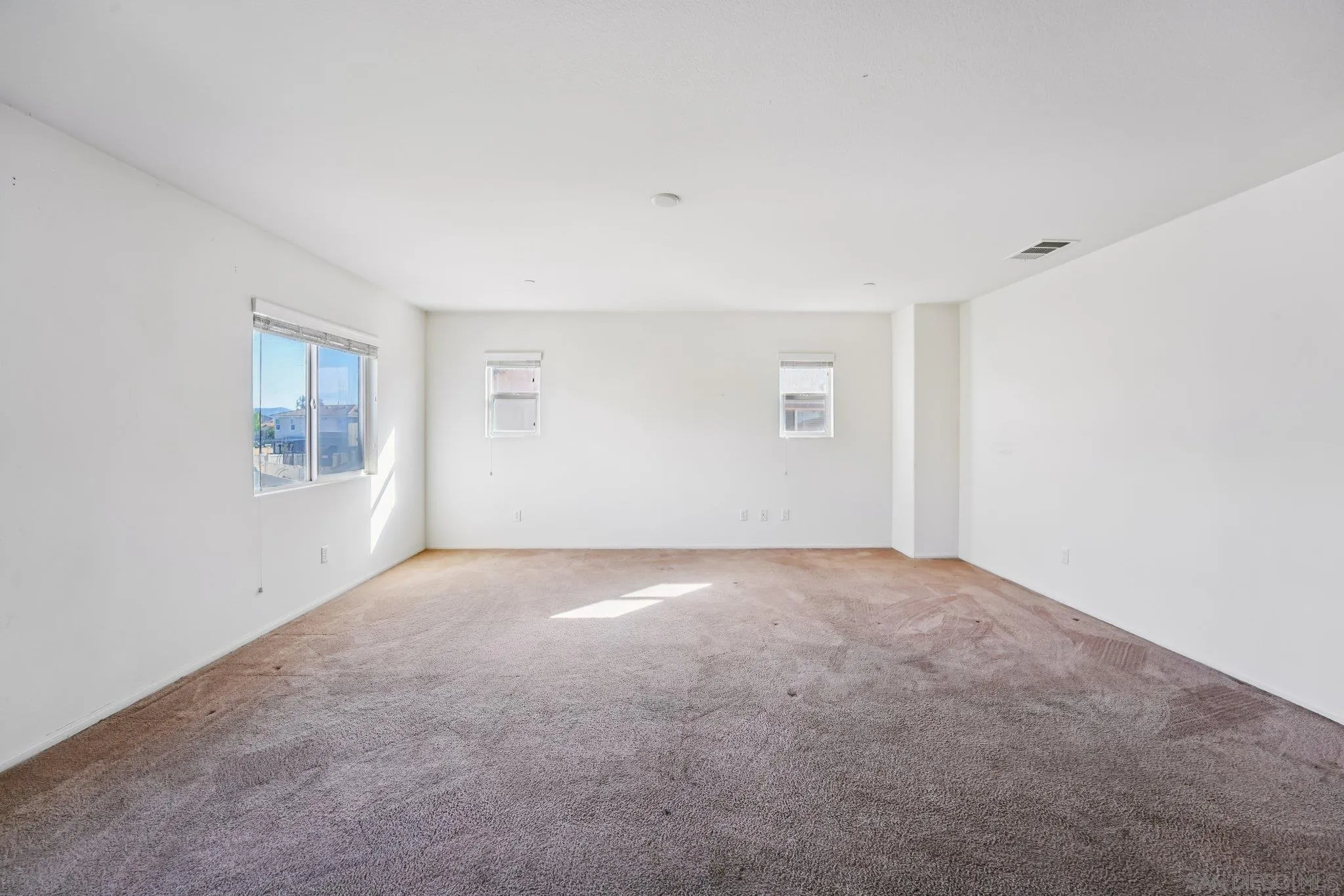 31890 Rouge Lane Menifee, CA 92584 - Photo 29 of 40 a view of an empty room with windows