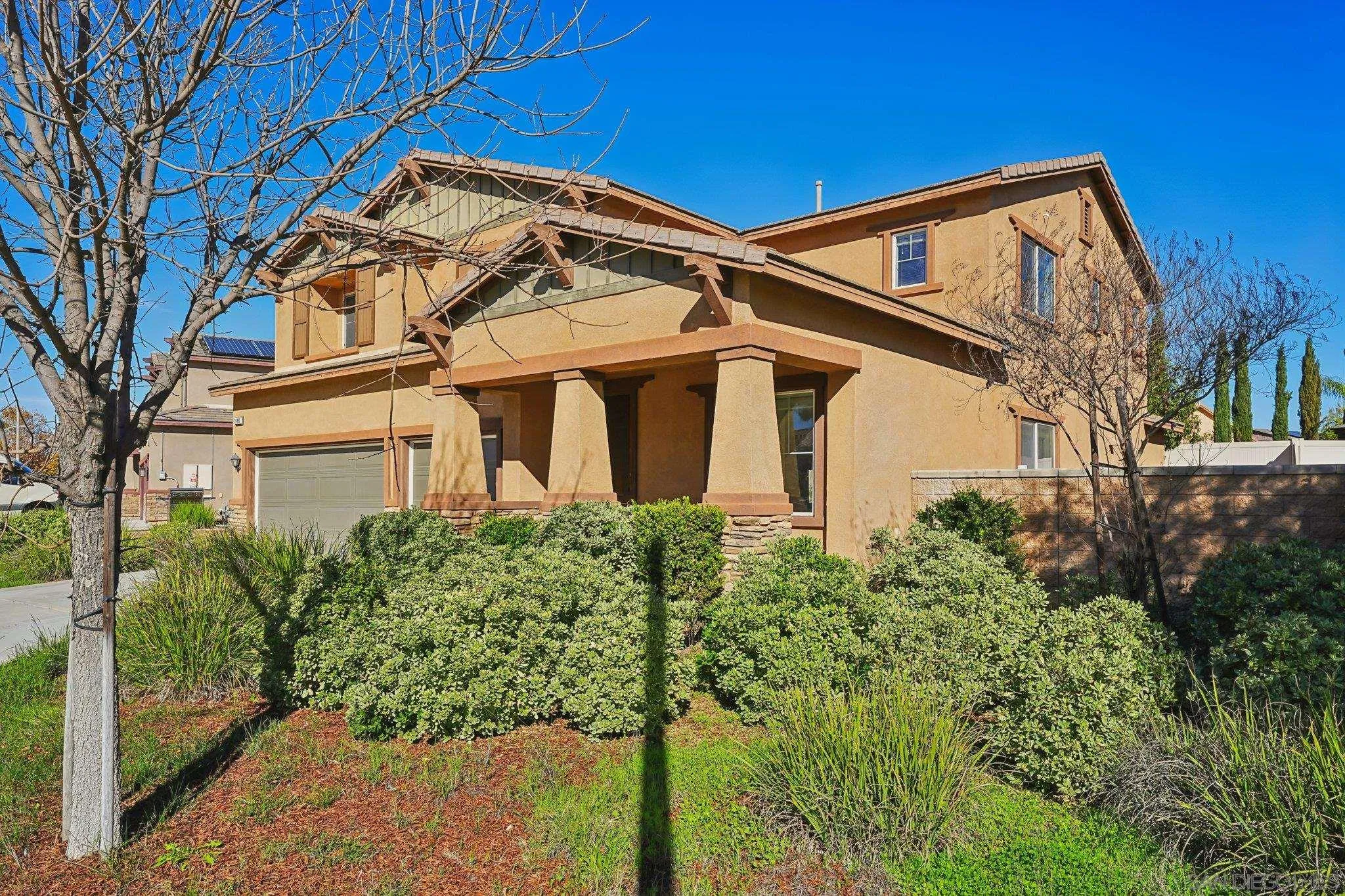 31890 Rouge Lane Menifee, CA 92584 - Photo 33 of 40 a front view of a house with a yard