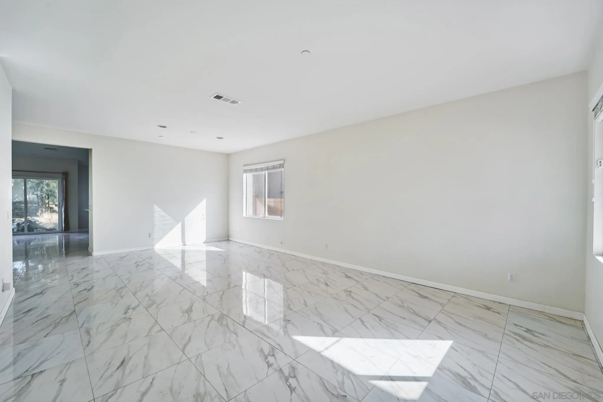 31890 Rouge Lane Menifee, CA 92584 - Photo 9 of 40 a view of empty room with wooden floor