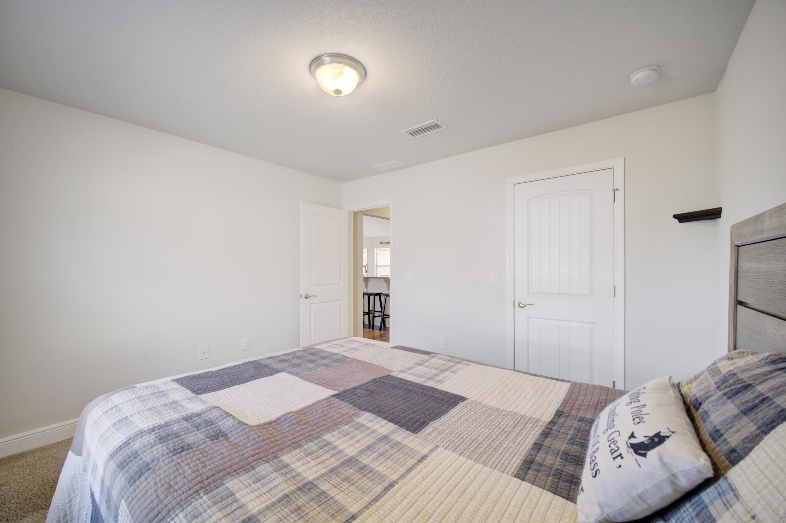 2045 Broad Street Crestview, FL 32536 - Photo 26 of 36 a bedroom with a bed and a window