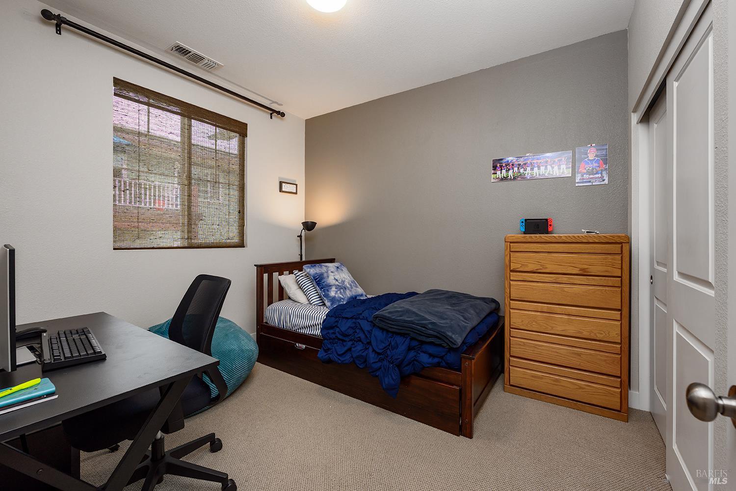 228 Johnson Street Windsor, CA 95492 - Photo 24 of 32 a bedroom with a bed and a window