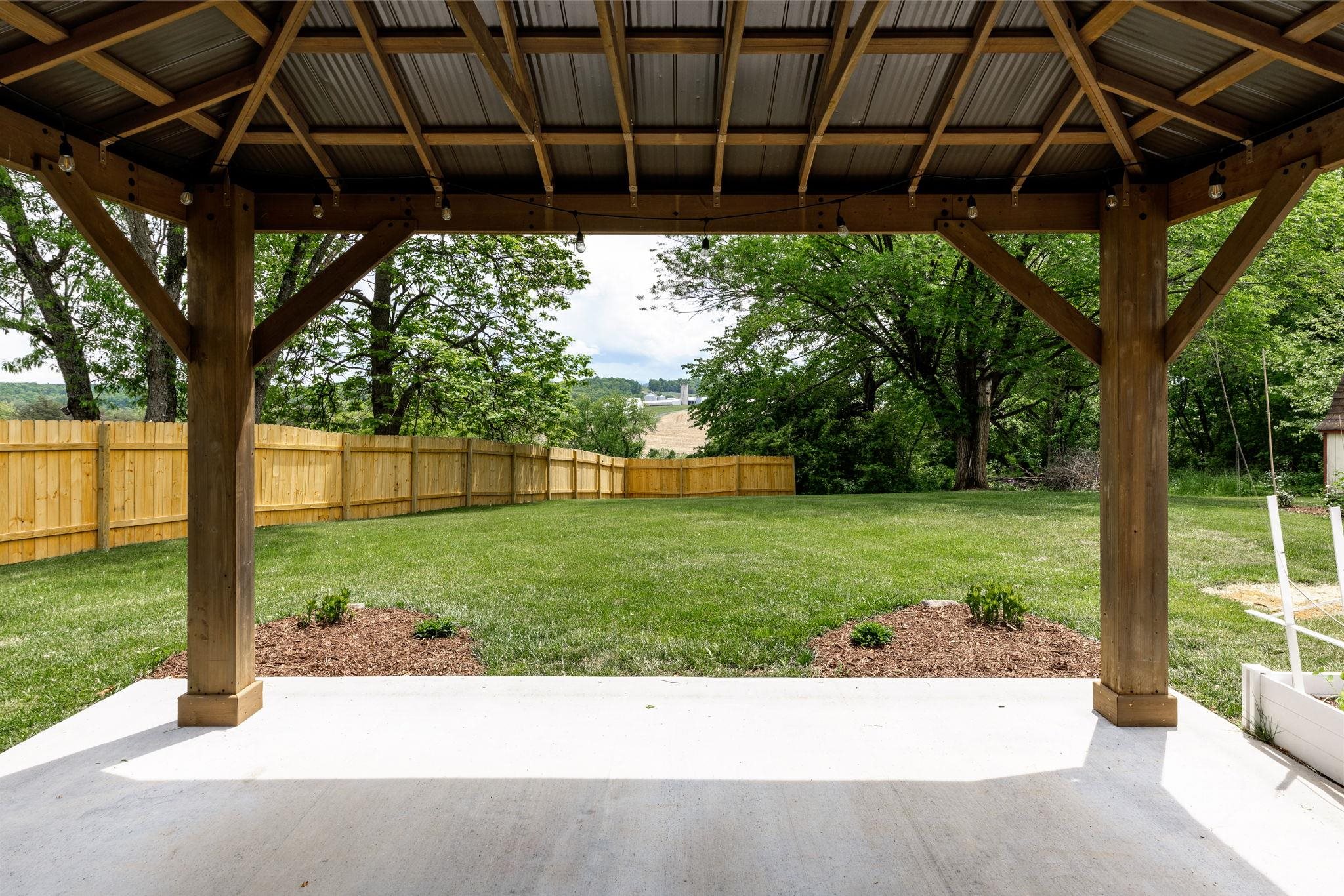 422 Cedar Green Road Staunton, VA 24401 - Photo 23 of 38 a view of a backyard with table and chairs under an umbrella