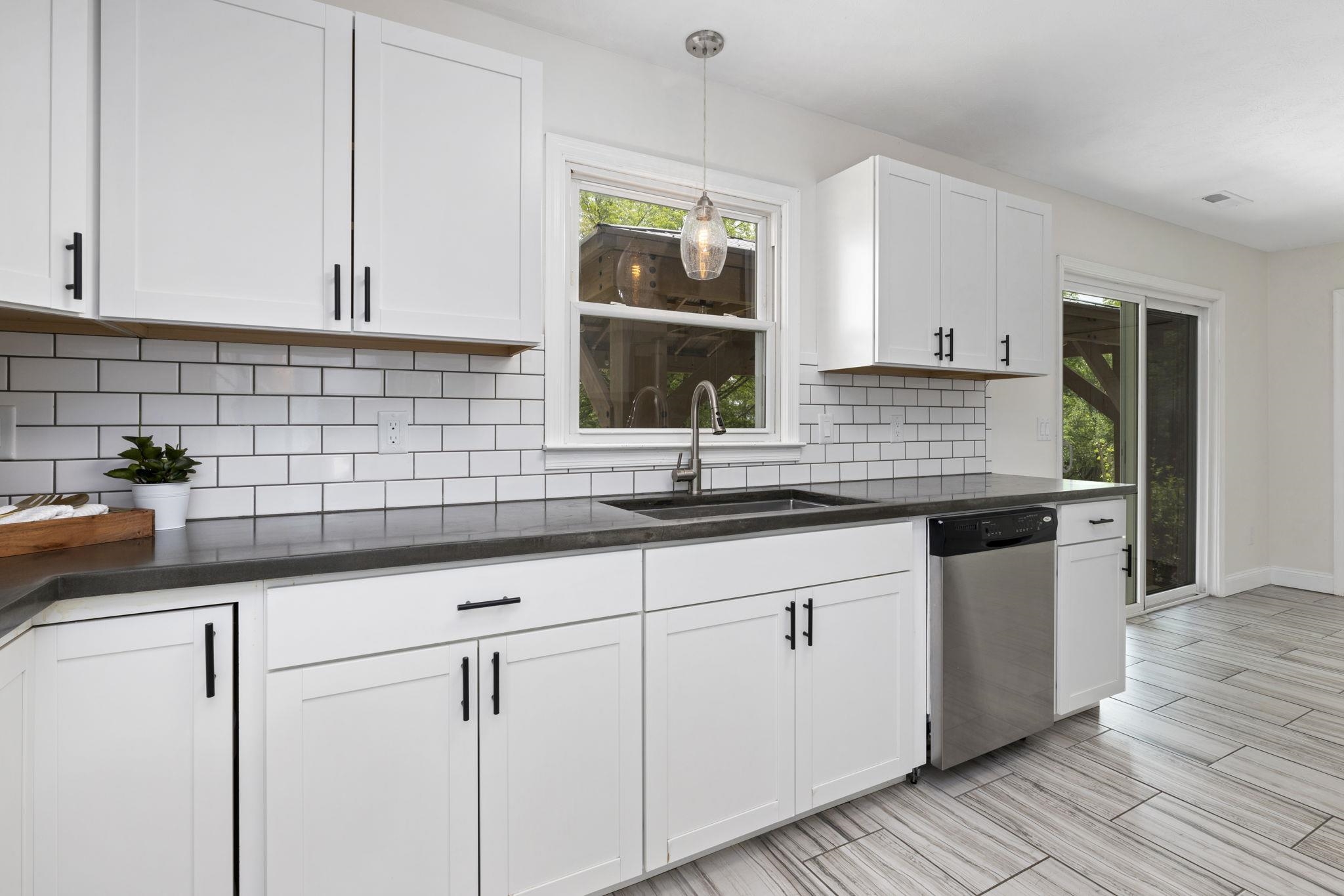 422 Cedar Green Road Staunton, VA 24401 - Photo 4 of 38 a kitchen with granite countertop white cabinets and a sink