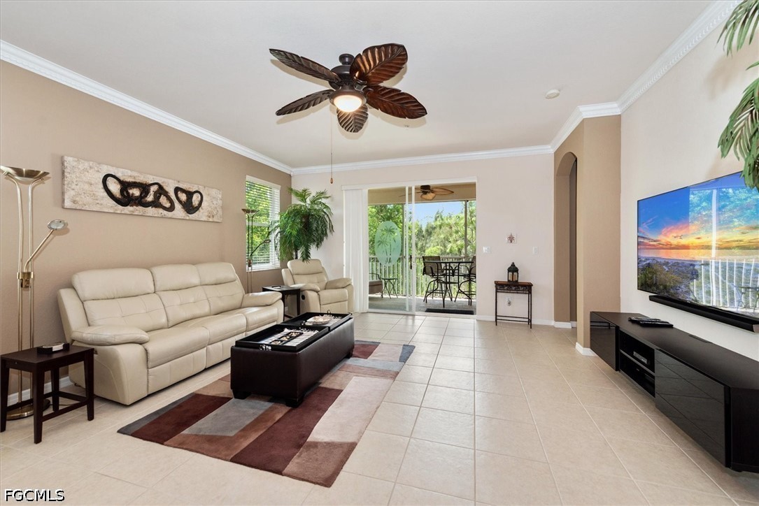 14951 Reflection Key Circle, Unit 531 Fort Myers, FL 33907 - Photo 11 of 36 a living room with furniture and a flat screen tv