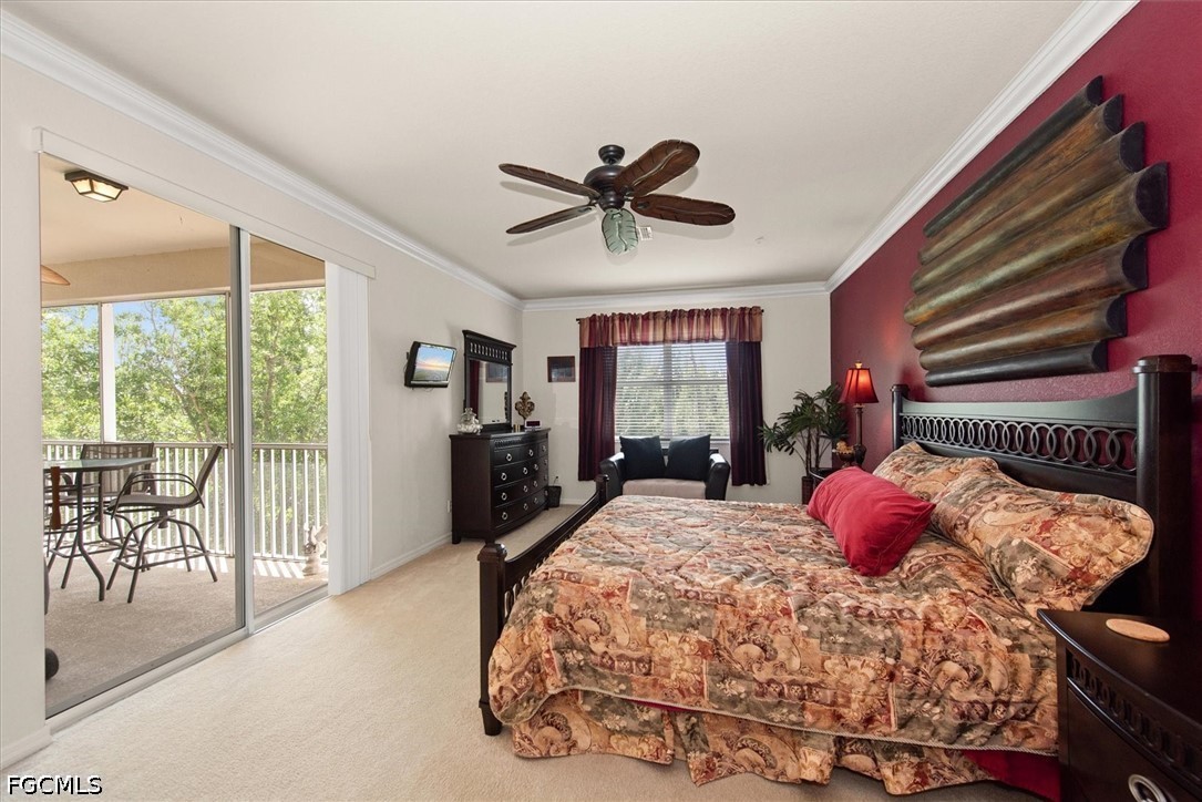 14951 Reflection Key Circle, Unit 531 Fort Myers, FL 33907 - Photo 17 of 36 a bedroom with a bed and large windows