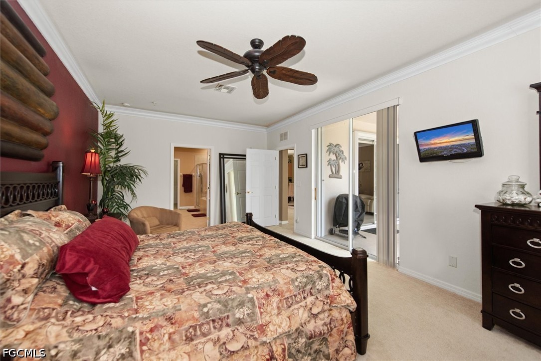 14951 Reflection Key Circle, Unit 531 Fort Myers, FL 33907 - Photo 18 of 36 a bedroom with a bed and a tv