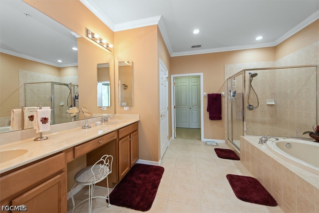 14951 Reflection Key Circle, Unit 531 Fort Myers, FL 33907 - Photo 19 of 36 a spacious bathroom with a tub sink shower and mirror