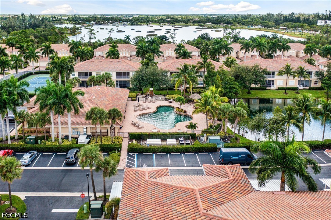 14951 Reflection Key Circle, Unit 531 Fort Myers, FL 33907 - Photo 2 of 36 an aerial view of multiple houses with yard