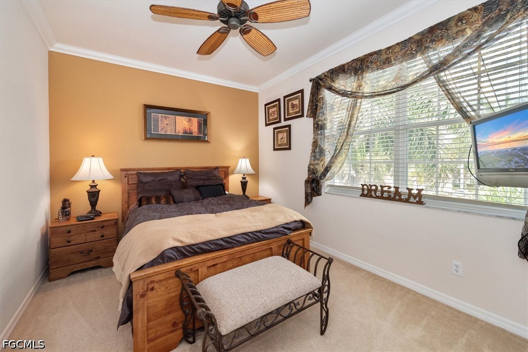 14951 Reflection Key Circle, Unit 531 Fort Myers, FL 33907 - Photo 21 of 36 a bedroom with a bed and window