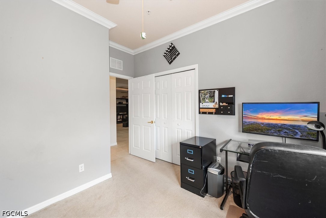 14951 Reflection Key Circle, Unit 531 Fort Myers, FL 33907 - Photo 25 of 36 a room with furniture and a flat screen tv