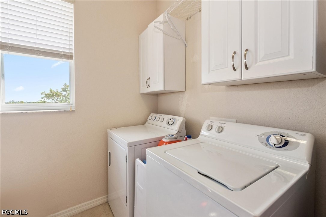 14951 Reflection Key Circle, Unit 531 Fort Myers, FL 33907 - Photo 26 of 36 a utility room with dryer and washer