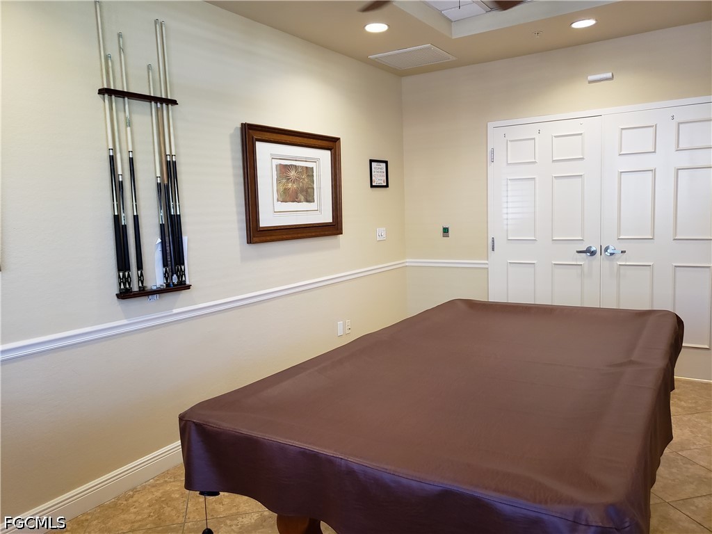 14951 Reflection Key Circle, Unit 531 Fort Myers, FL 33907 - Photo 35 of 36 a living room with furniture and a window
