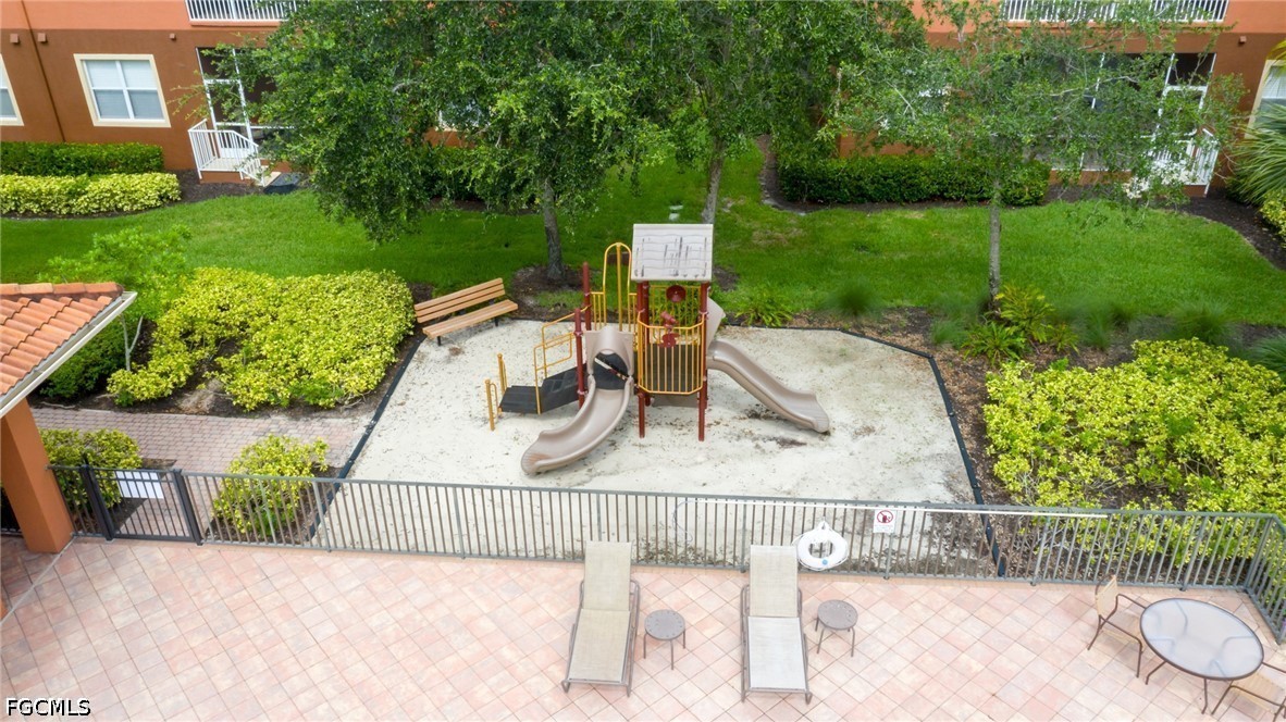 14951 Reflection Key Circle, Unit 531 Fort Myers, FL 33907 - Photo 36 of 36 a view of yard from deck with patio