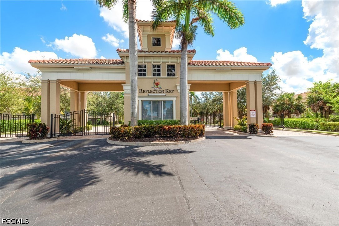 14951 Reflection Key Circle, Unit 531 Fort Myers, FL 33907 - Photo 4 of 36 front view of a house with a patio