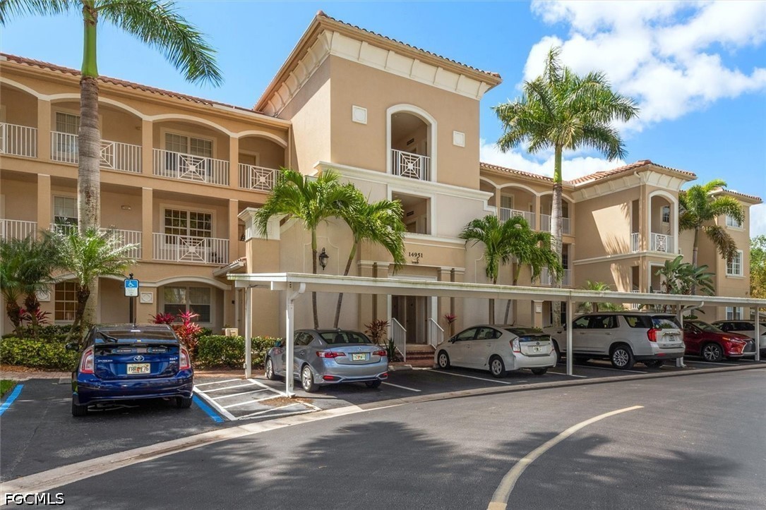 14951 Reflection Key Circle, Unit 531 Fort Myers, FL 33907 - Photo 5 of 36 a car parked in front of a building