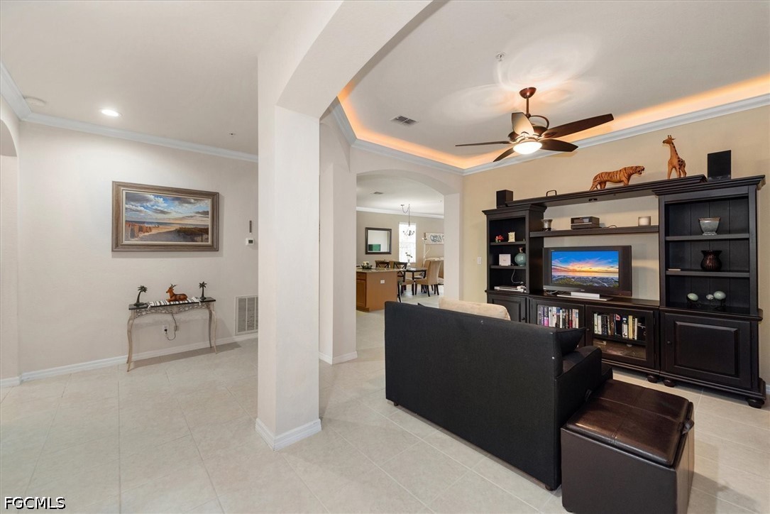 14951 Reflection Key Circle, Unit 531 Fort Myers, FL 33907 - Photo 7 of 36 a living room with furniture and a flat screen tv