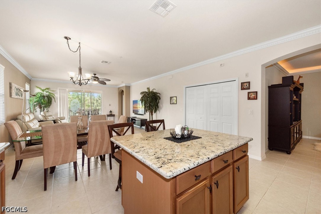 14951 Reflection Key Circle, Unit 531 Fort Myers, FL 33907 - Photo 10 of 36 a kitchen with a table and chairs in it