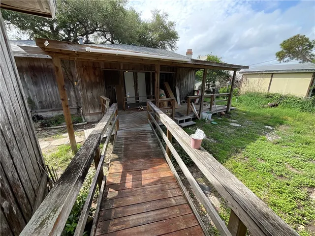 a view of a refrigerator with wooden floor