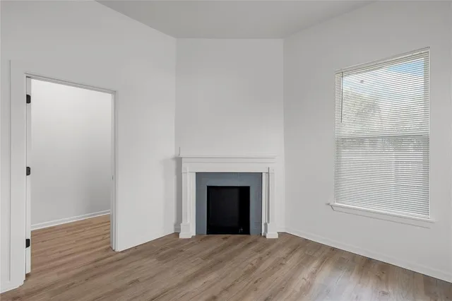 a view of a livingroom with a ceiling fan and window