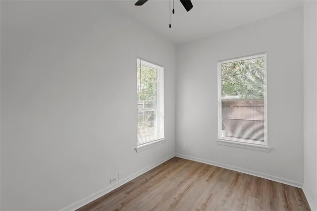 a bathroom with a toilet a sink and a mirror