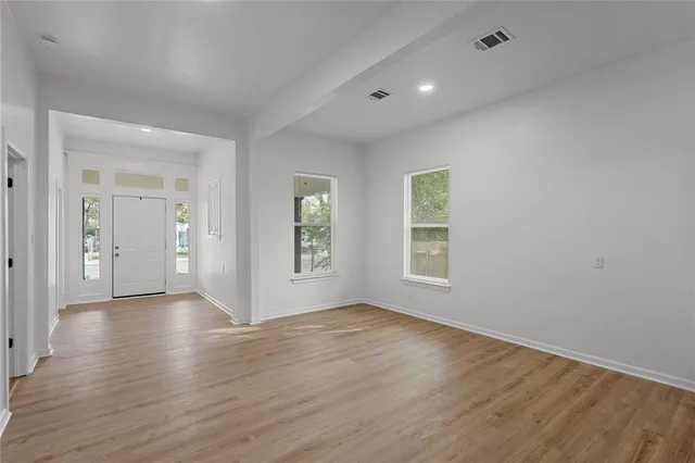 a view of a kitchen with wooden floor