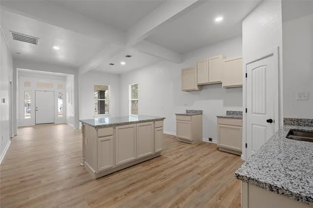 a view of kitchen with wooden floor