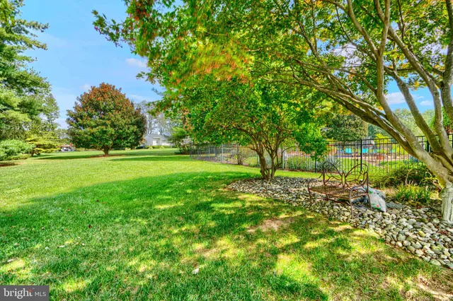 a view of outdoor space with deck and yard