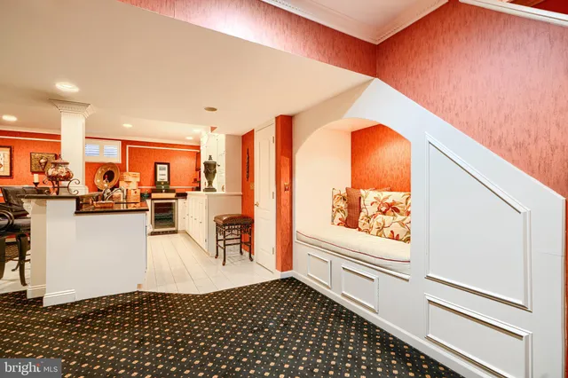 a very nice looking living room with a large window and stainless steel appliances