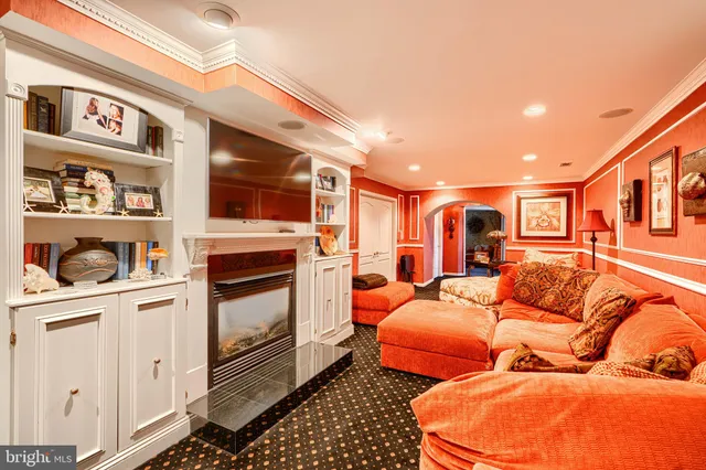 a bedroom with furniture and a rug