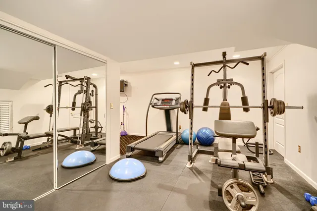 an aerial view of a house with a yard swimming pool and outdoor seating