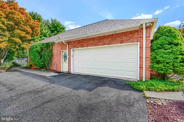 a view of backyard of house and garage