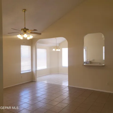 a view of a room with window and chandelier