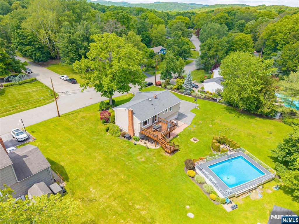 55 Marcia Road Ringwood, NJ 07456 - Photo 4 of 42 an aerial view of a house with a swimming pool