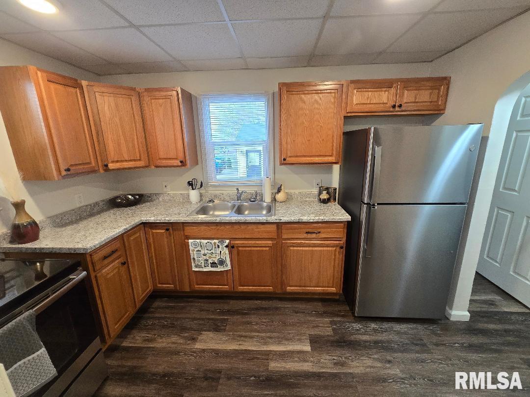 418 19th Avenue North Clinton, IA 52732 - Photo 15 of 28 a kitchen with stainless steel appliances granite countertop a refrigerator a sink a stove a washer dryer and a window