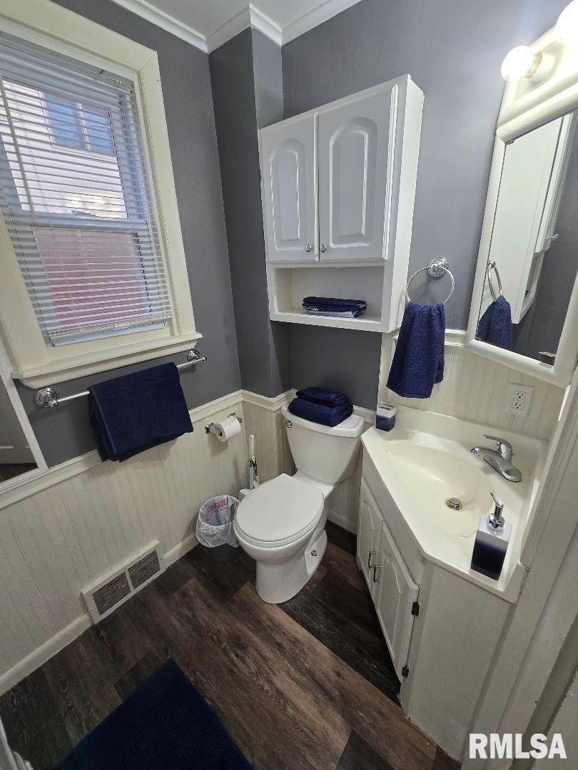 418 19th Avenue North Clinton, IA 52732 - Photo 19 of 28 a bathroom with a sink and a toilet