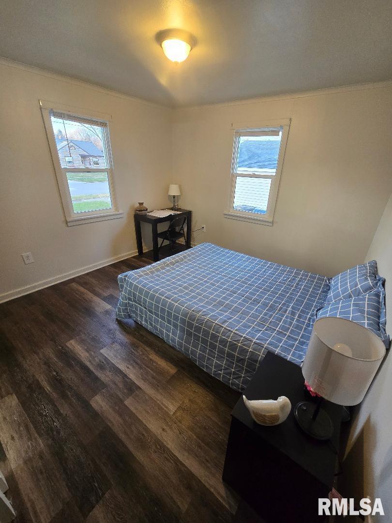 418 19th Avenue North Clinton, IA 52732 - Photo 21 of 28 a bedroom with a bed and wooden floor