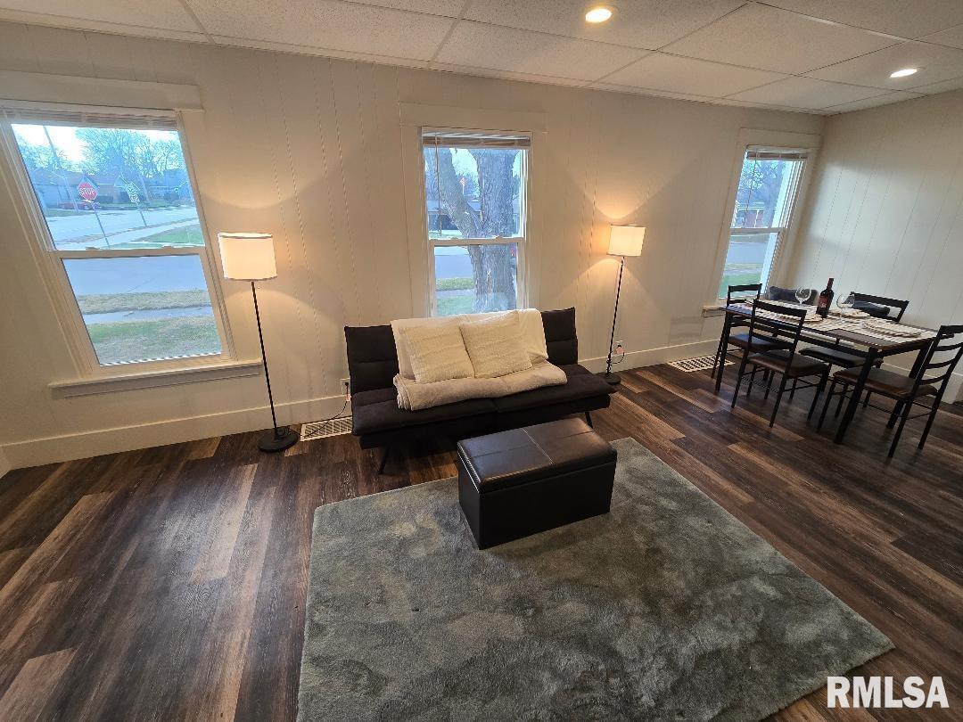 418 19th Avenue North Clinton, IA 52732 - Photo 10 of 28 a living room with furniture and a wooden floor