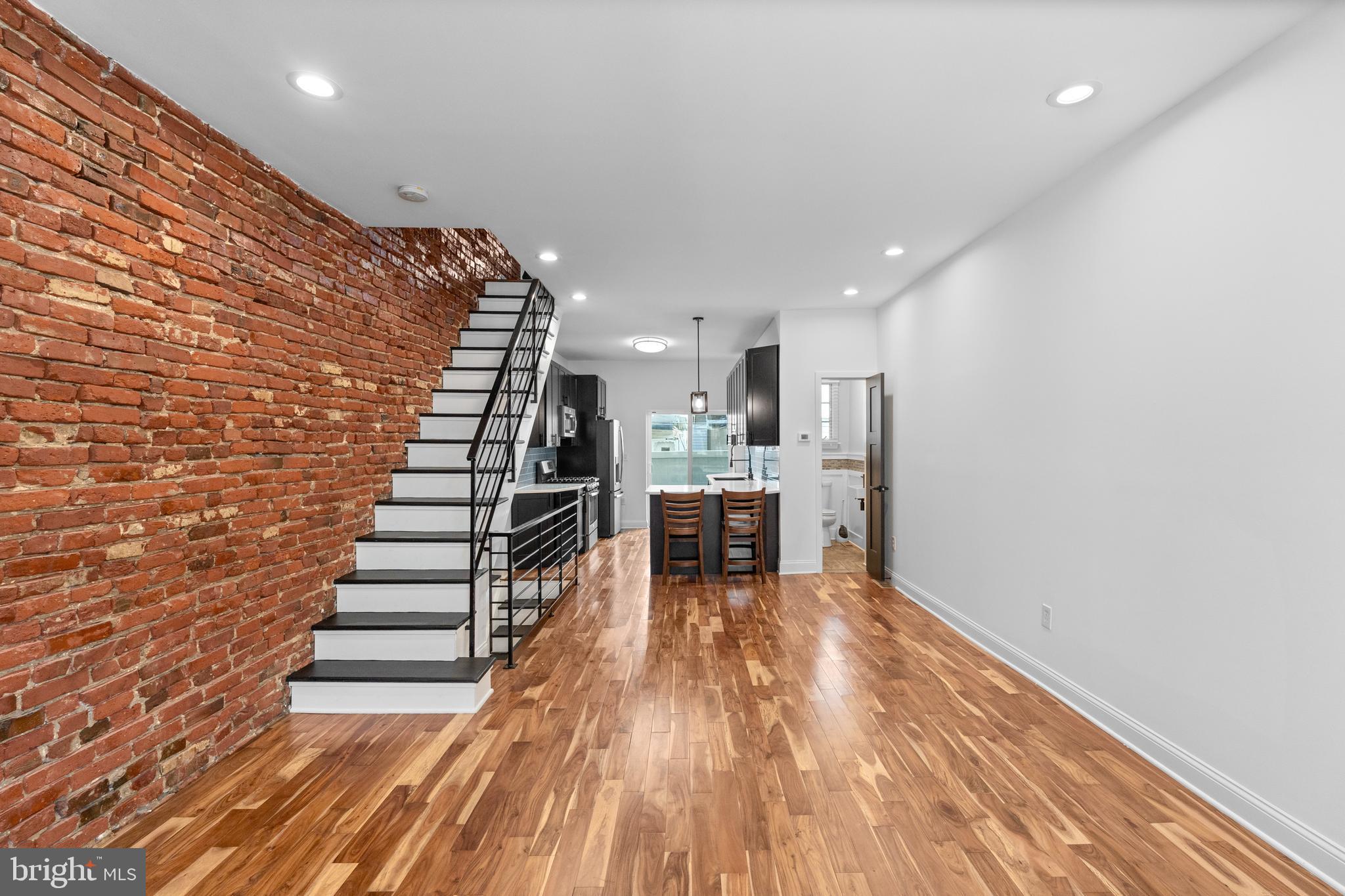 345 Roseberry Street Philadelphia, PA 19148 - Photo 11 of 30 a view of kitchen and hall with wooden floor