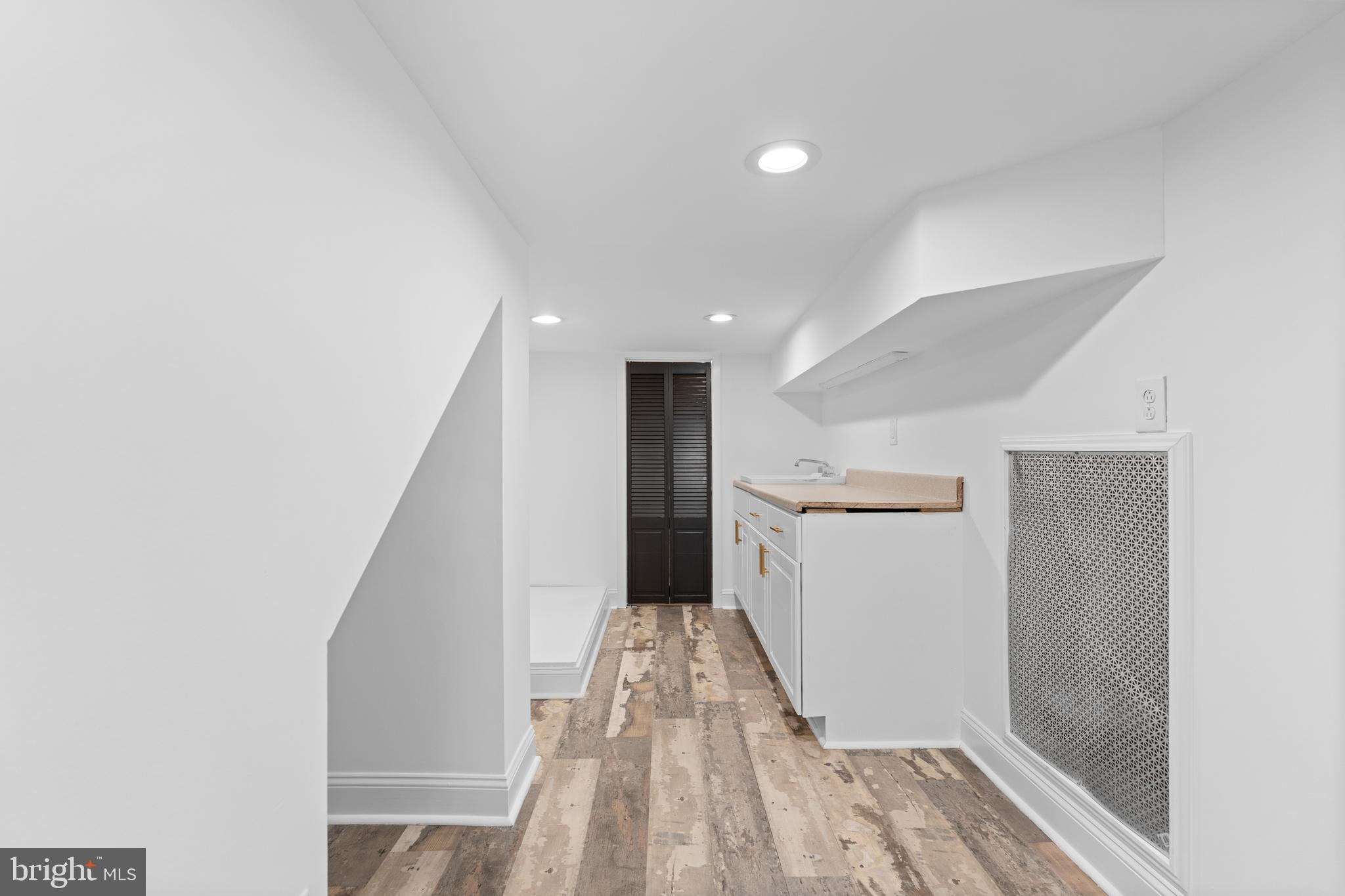 345 Roseberry Street Philadelphia, PA 19148 - Photo 16 of 30 a view of a hallway with wooden floor and staircase