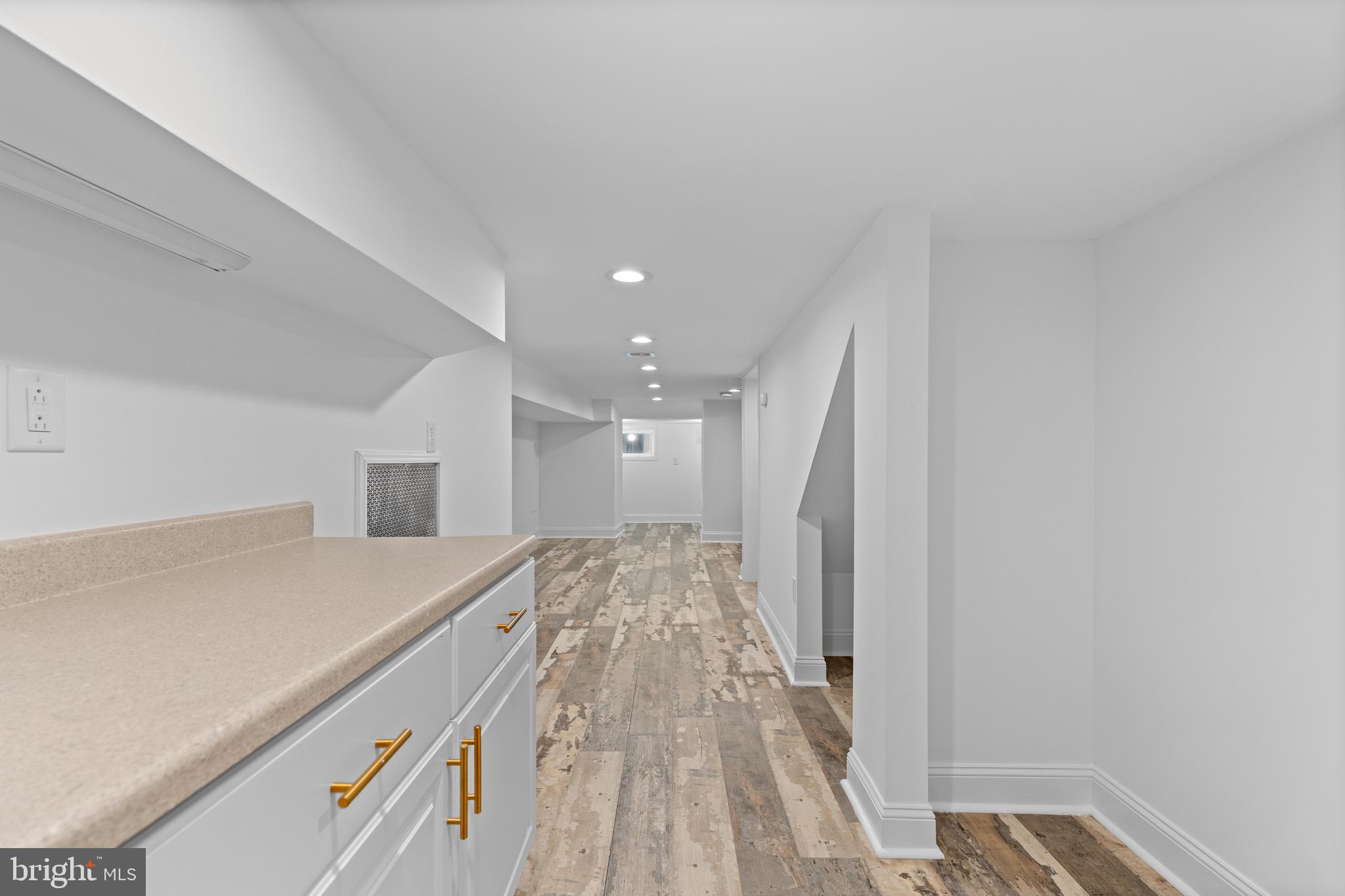 345 Roseberry Street Philadelphia, PA 19148 - Photo 17 of 30 a view of hallway with kitchen and wooden floor