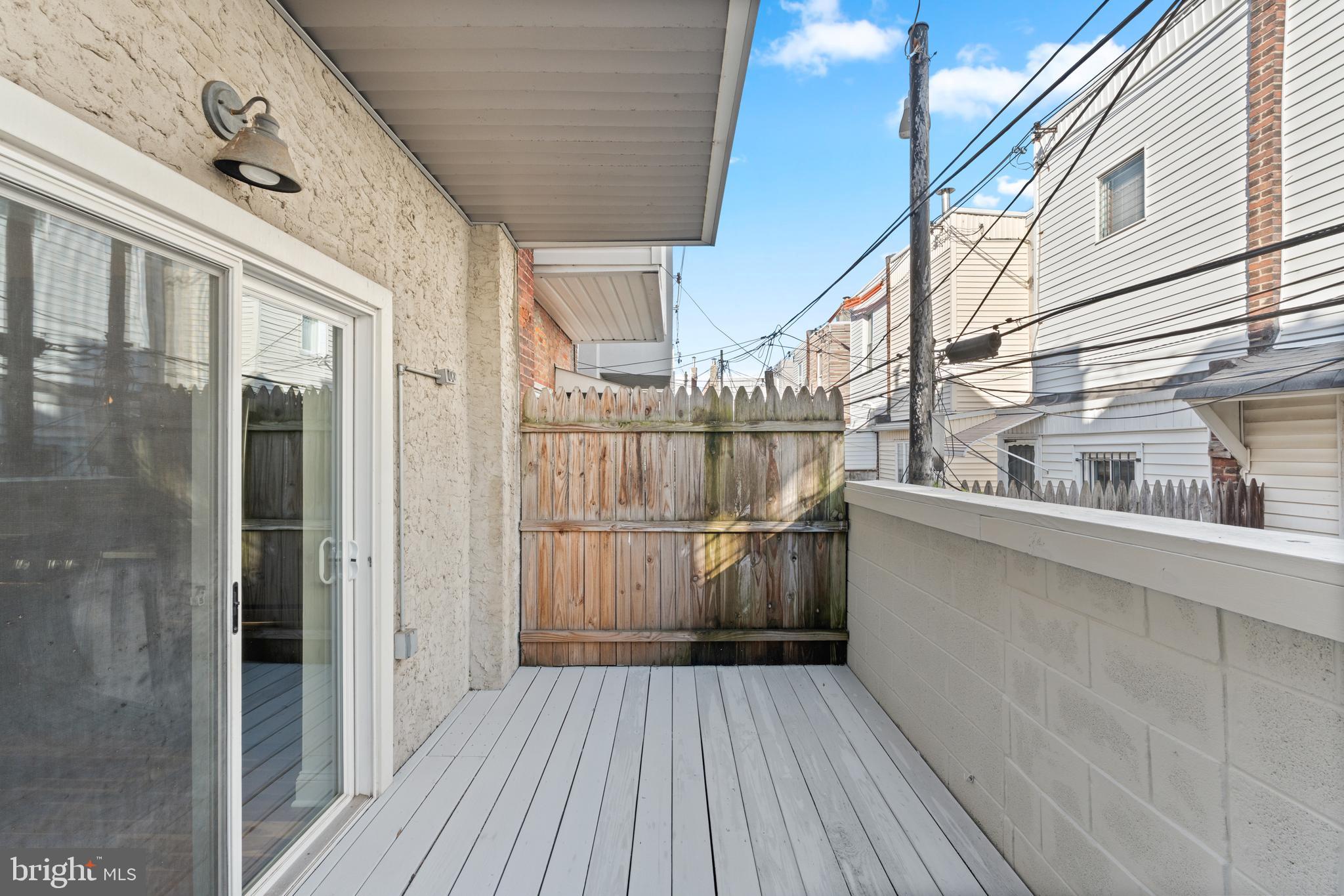 345 Roseberry Street Philadelphia, PA 19148 - Photo 28 of 30 a view of a balcony with wooden floor