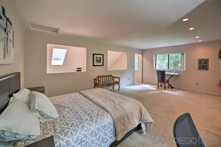16885 Laurel Road Los Gatos, CA 95033 - Photo 14 of 40 a bedroom with a bed and a couch