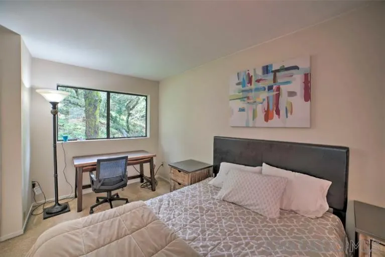 16885 Laurel Road Los Gatos, CA 95033 - Photo 16 of 40 a bedroom with a bed and a large window