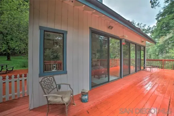a balcony with furniture and wooden deck