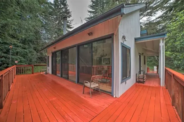a balcony with couch and wooden floor